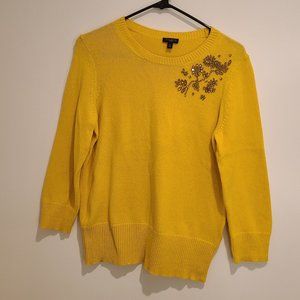 Bright yellow sweater with jewels